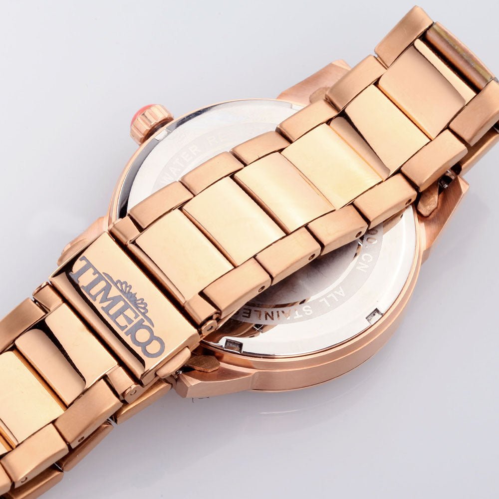 Close-up of the artistic TIME100 watch face showing the owl design, weekday, and full calendar functions Back - Time100