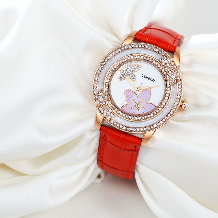 Elegant evening style featuring the TIME100 W80105L women's quartz watch catching the light Red - Time100