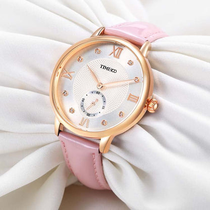 Close-up of the pure white embossed dial featuring 8 brilliant diamonds and classic Roman numerals Pink - Time100