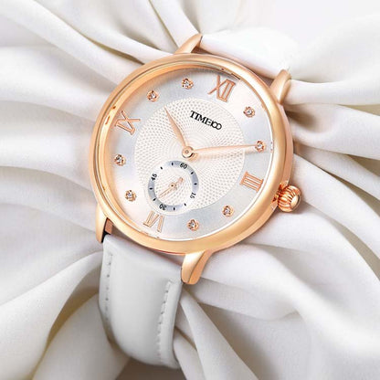 Close-up of the pure white embossed dial featuring 8 brilliant diamonds and classic Roman numerals White - Time100