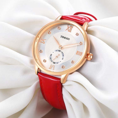 Close-up of the pure white embossed dial featuring 8 brilliant diamonds and classic Roman numerals Red - Time100