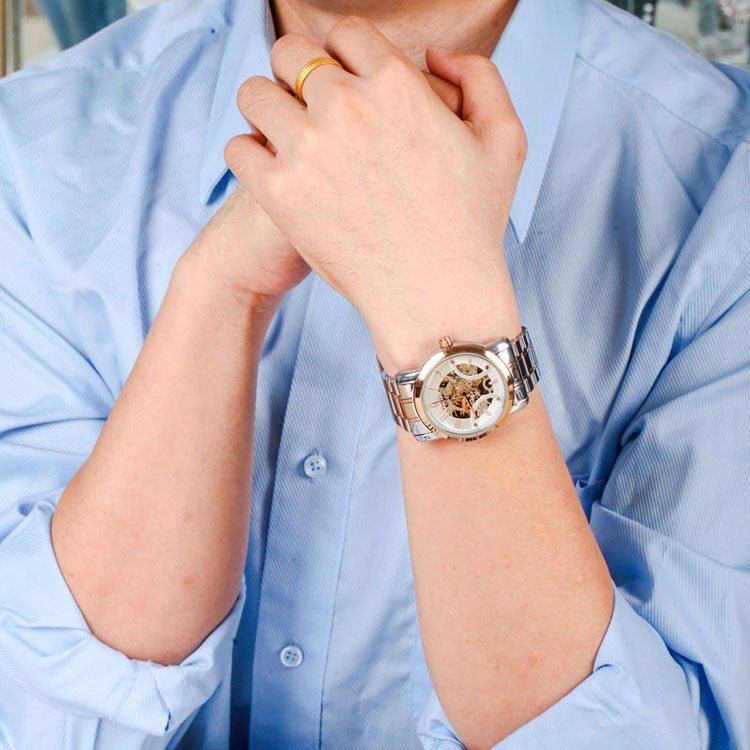 Professional man wearing the TIME100 industrial-inspired skeleton watch with a business suit Gold - Time100