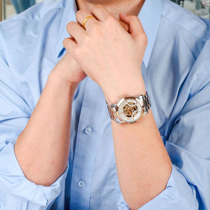 Professional man wearing the TIME100 industrial-inspired skeleton watch with a business suit Gold - Time100