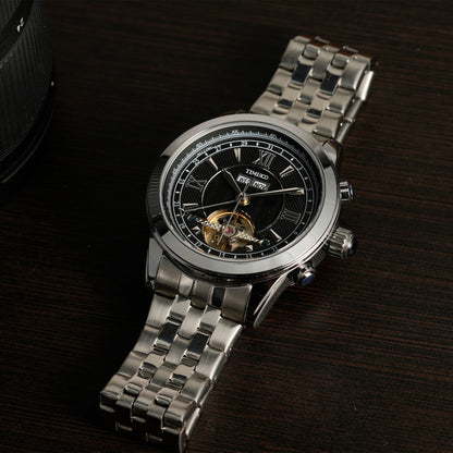 Detail of the polished stainless steel bracelet and case on the TIME100 W60069G automatic timepiece Silver Black - Time100