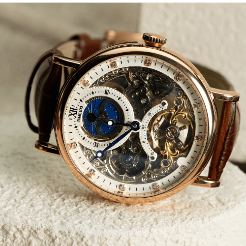 Close-up of the intricate self-winding mechanical movement and balance wheel on the TIME100 skeleton watch Brown - Time100