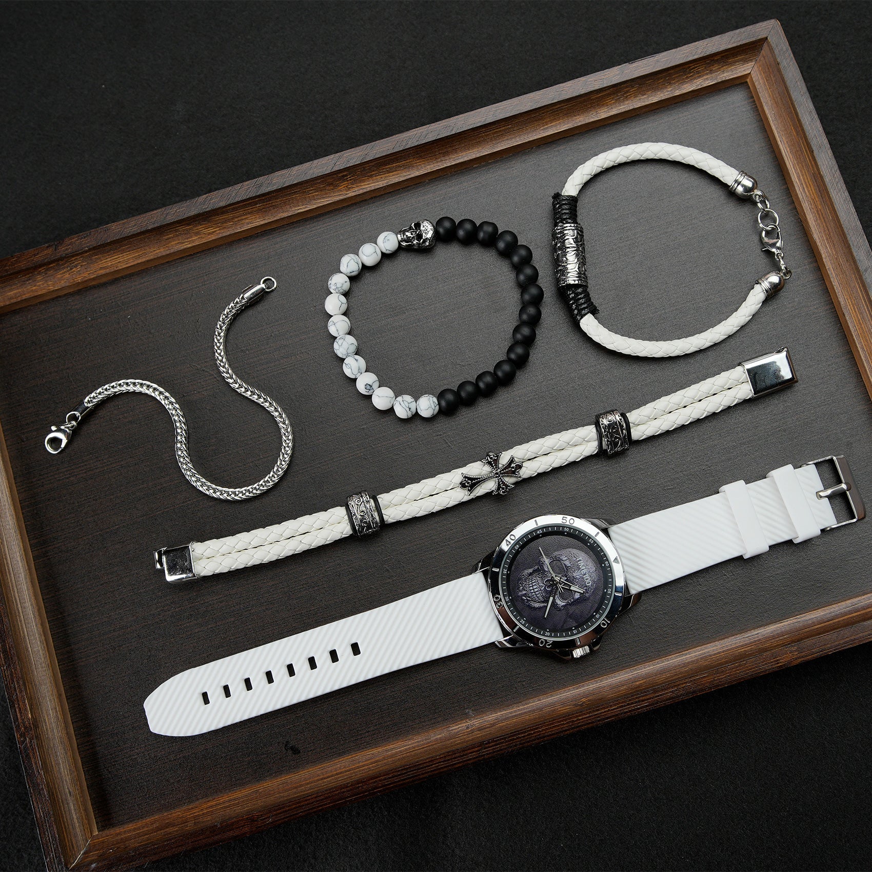 Close-up of the easy-to-read TIME100 black skull dial and precision quartz movement White - Time100