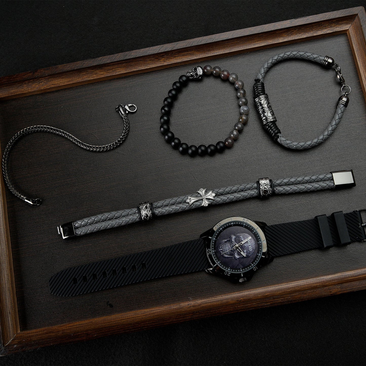 Close-up of the easy-to-read TIME100 black skull dial and precision quartz movement Black - Time100