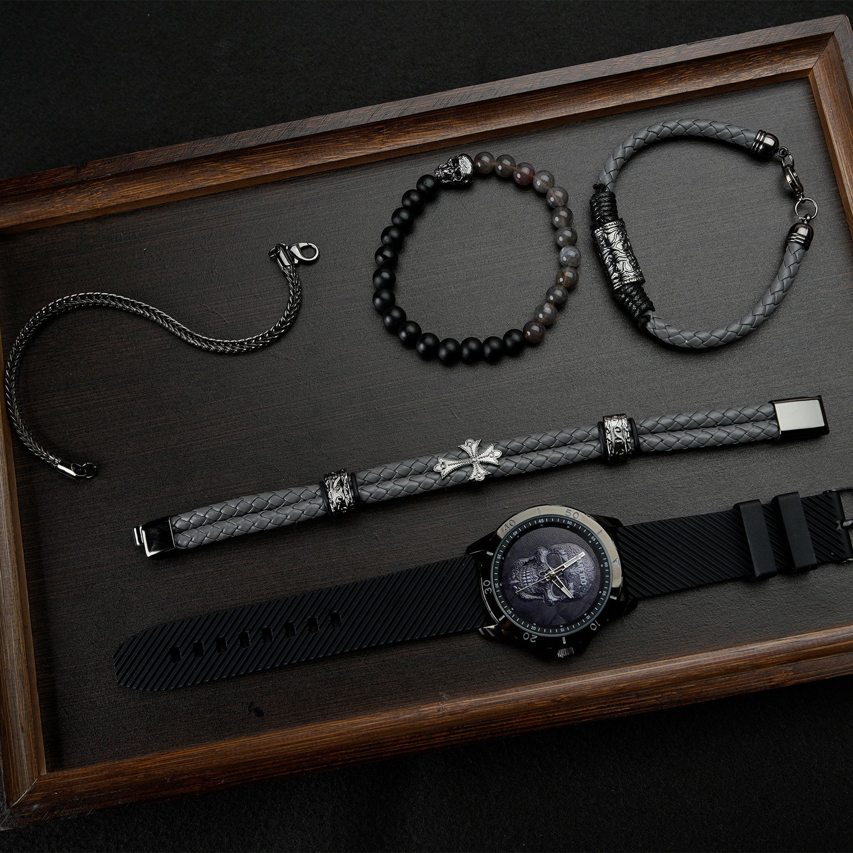 Close-up of the easy-to-read TIME100 black skull dial and precision quartz movement Black - Time100