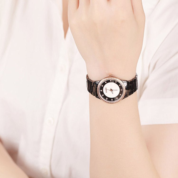 Modern professional woman wearing the black ceramic TIME100 watch with business attire Black - Time100
