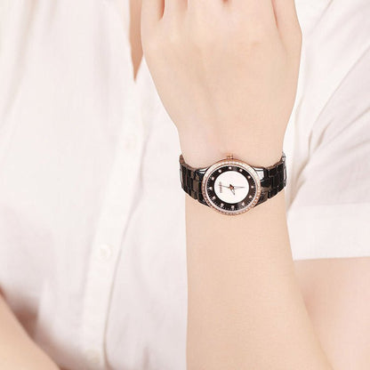 Modern professional woman wearing the black ceramic TIME100 watch with business attire Black - Time100