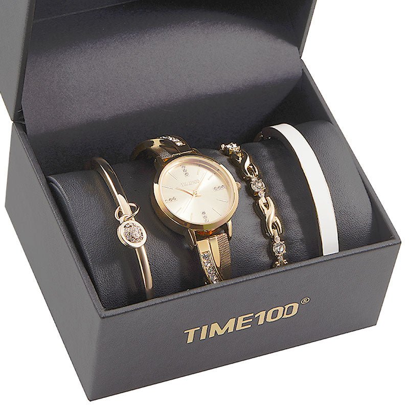 Sophisticated multi-layered look featuring the TIME100 silver watch stacked with matching bracelets Gold - Time100