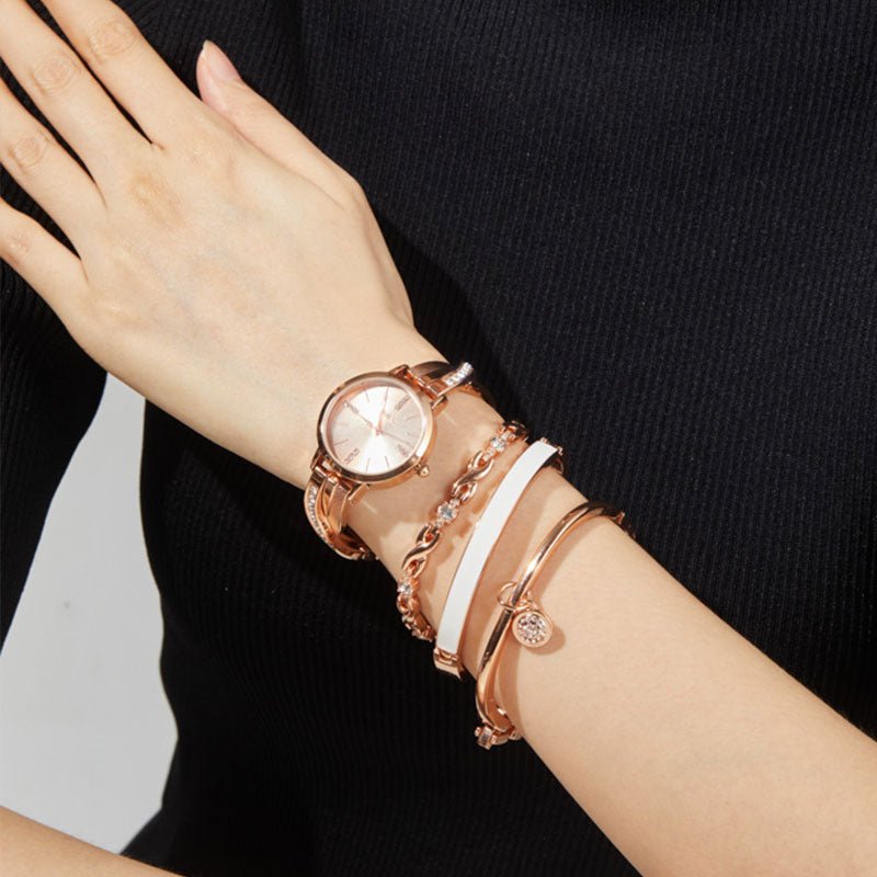 Sophisticated multi-layered look featuring the TIME100 silver watch stacked with matching bracelets Rose Gold - Time100