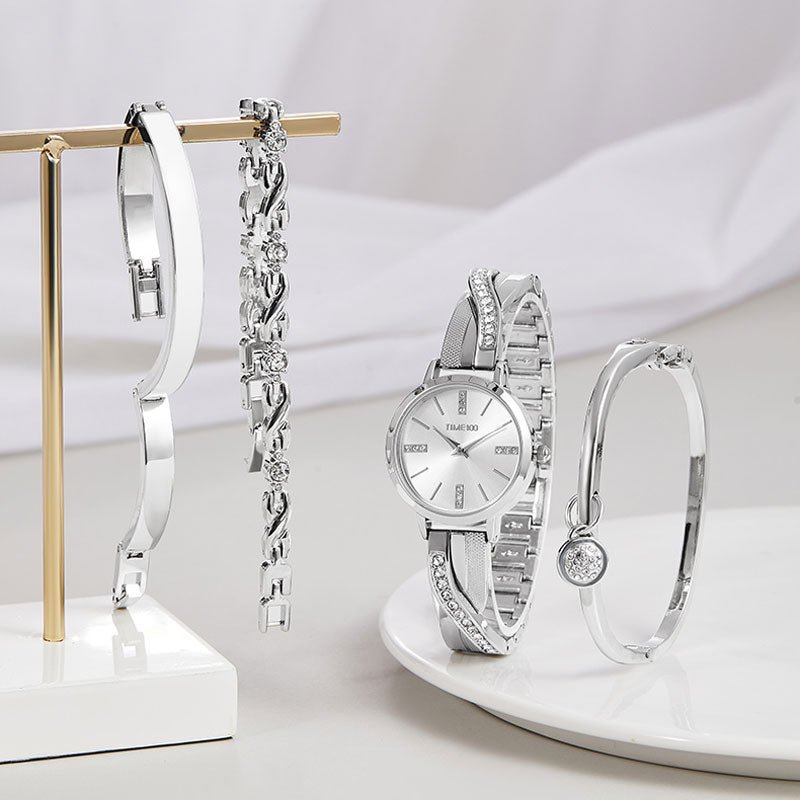 Detail of the included white enamel bangle, crystal charm bangle, and X-shaped link bracelet Silver - Time100