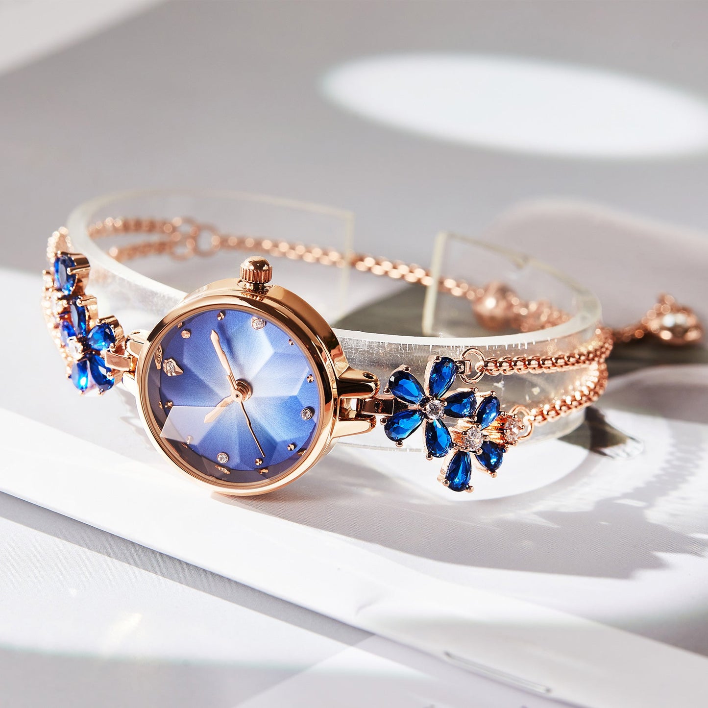 Close-up of TIME100 Stella watch showing the unique cut mirror crystal lens and periwinkle flower dial Blue - Time100