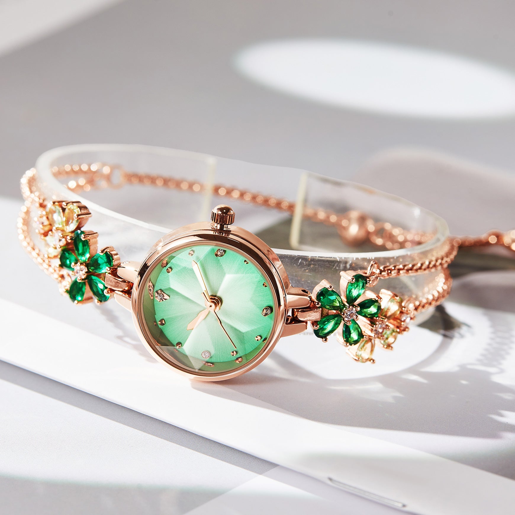 Close-up of TIME100 Stella watch showing the unique cut mirror crystal lens and periwinkle flower dial Green - Time100