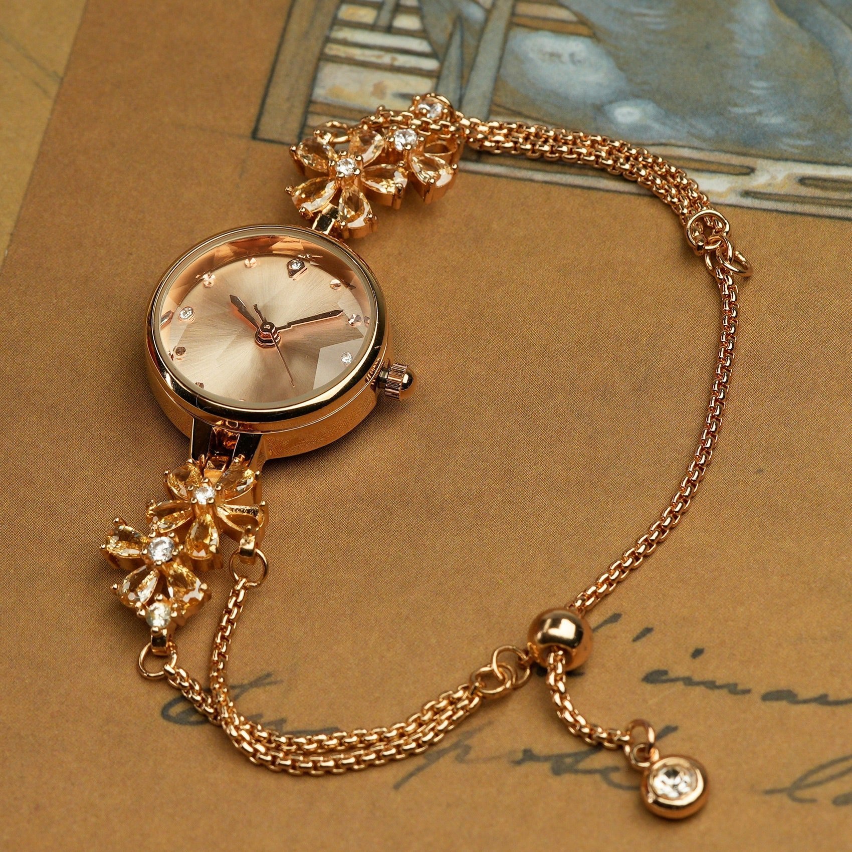 Woman wearing the TIME100 Stella periwinkle flower dial watch as a spring fashion statement piece Gold - Time100