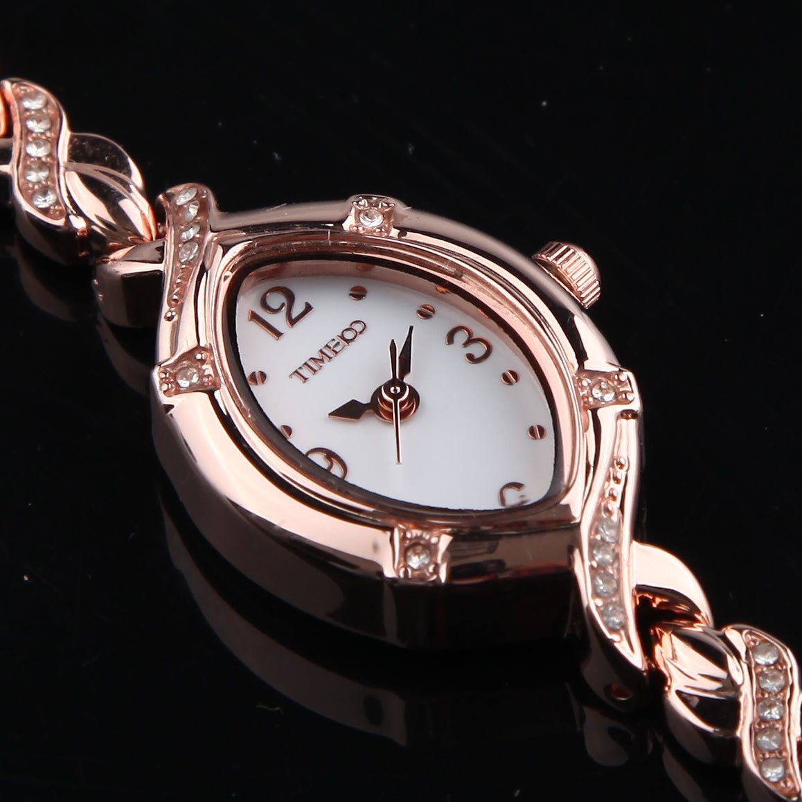 Distinctive rose gold-tone oval case design of the TIME100 Soho women's timepiece three - Time100