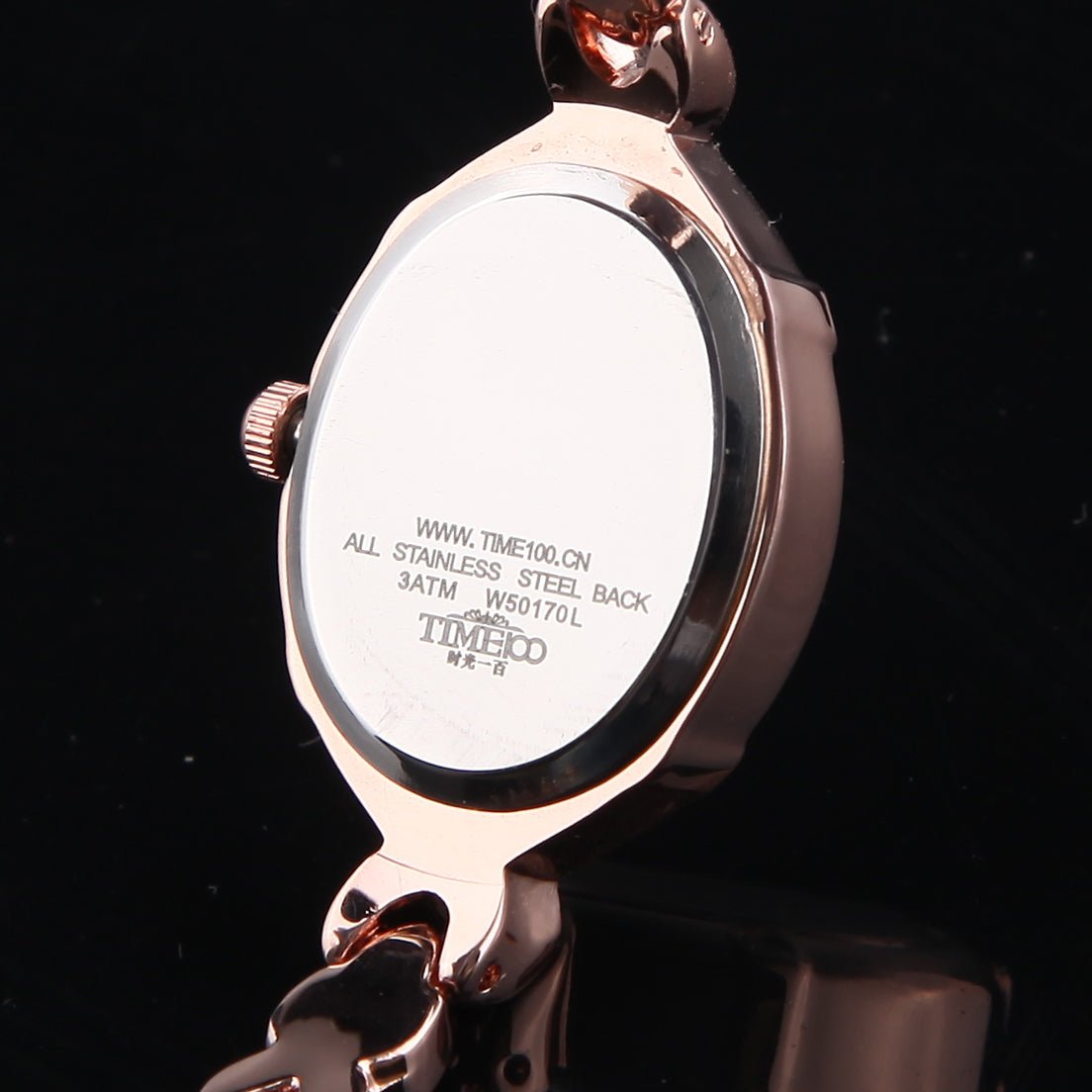 Distinctive rose gold-tone oval case design of the TIME100 Soho women's timepiece two - Time100