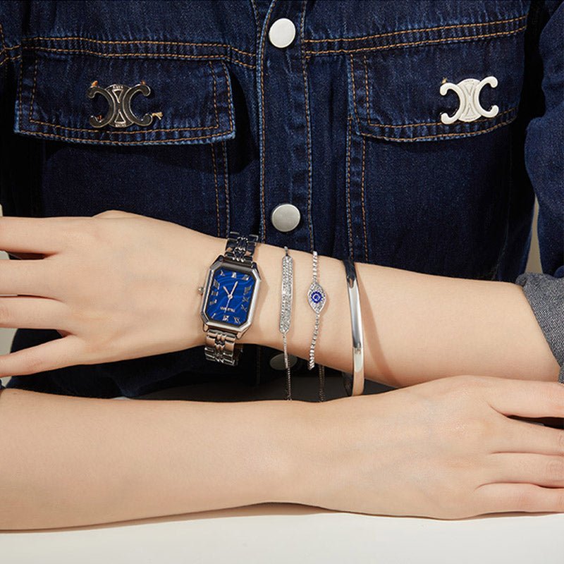 High-fashion aesthetic showing the emerald green watch layered with gold bracelets for a social event Silver - Time100