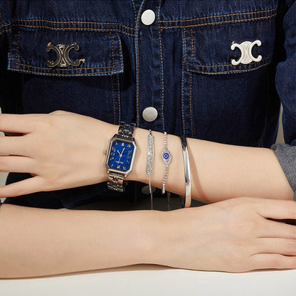 High-fashion aesthetic showing the emerald green watch layered with gold bracelets for a social event Silver - Time100