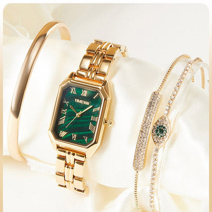 Detail of the three matching gold-tone stacking bracelets with adjustable jewelry clasps included in the set Gold - Time100