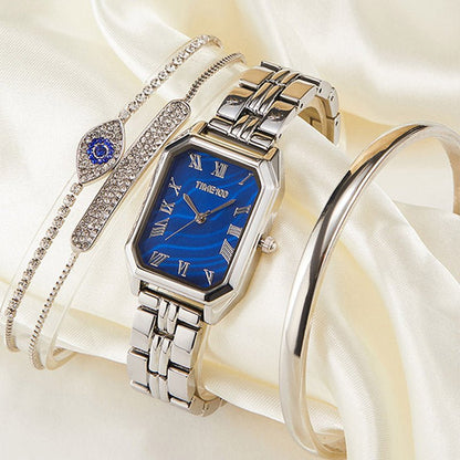 Detail of the three matching gold-tone stacking bracelets with adjustable jewelry clasps included in the set Silver - Time100