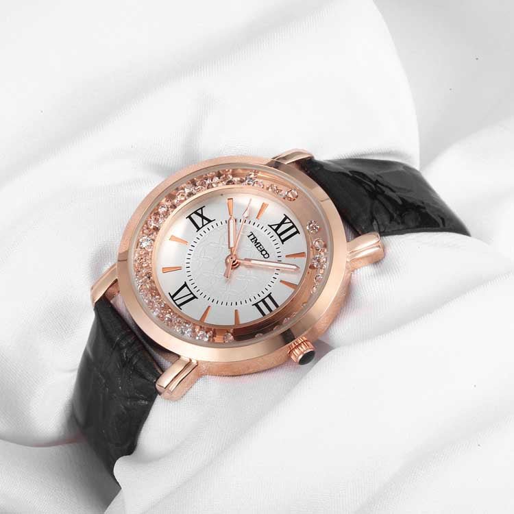 Close-up of the elegant purple dial featuring easy-to-read Roman numerals and a crystal-encrusted bezel Black - Time100