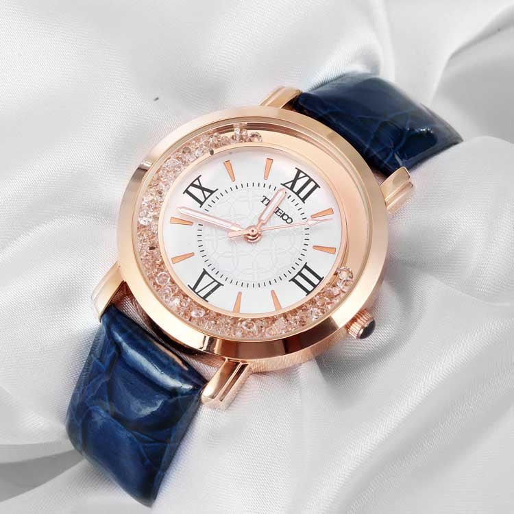 Close-up of the elegant purple dial featuring easy-to-read Roman numerals and a crystal-encrusted bezel Blue - Time100