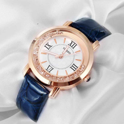 Close-up of the elegant purple dial featuring easy-to-read Roman numerals and a crystal-encrusted bezel Blue - Time100