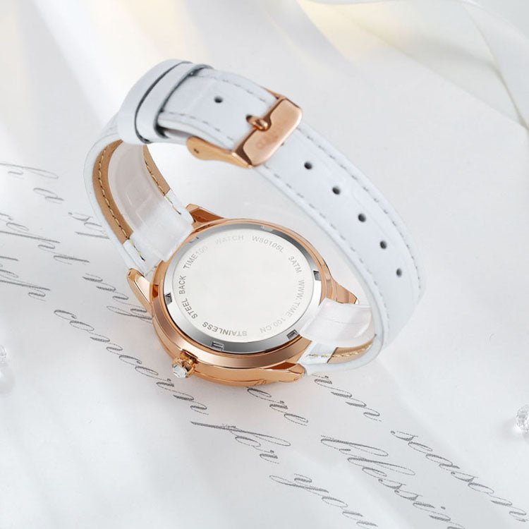 Close-up of the clean analog dial, crystal embellishments, and high-hardness mineral glass on the watch White - Time100