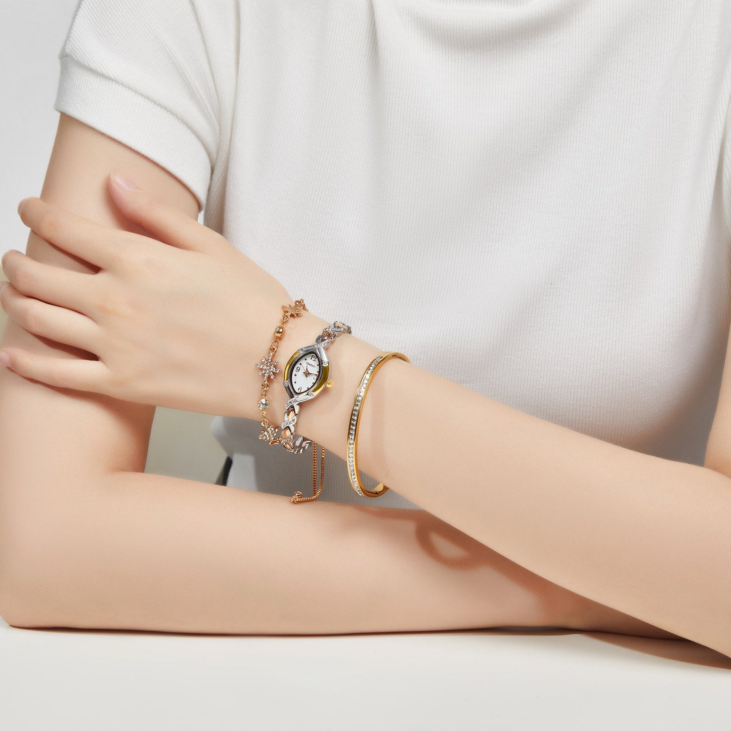 Detail of the elegant rose gold-tone matching bracelets from the TIME100 Chelsea jewelry collection Silver and Gold - Time100