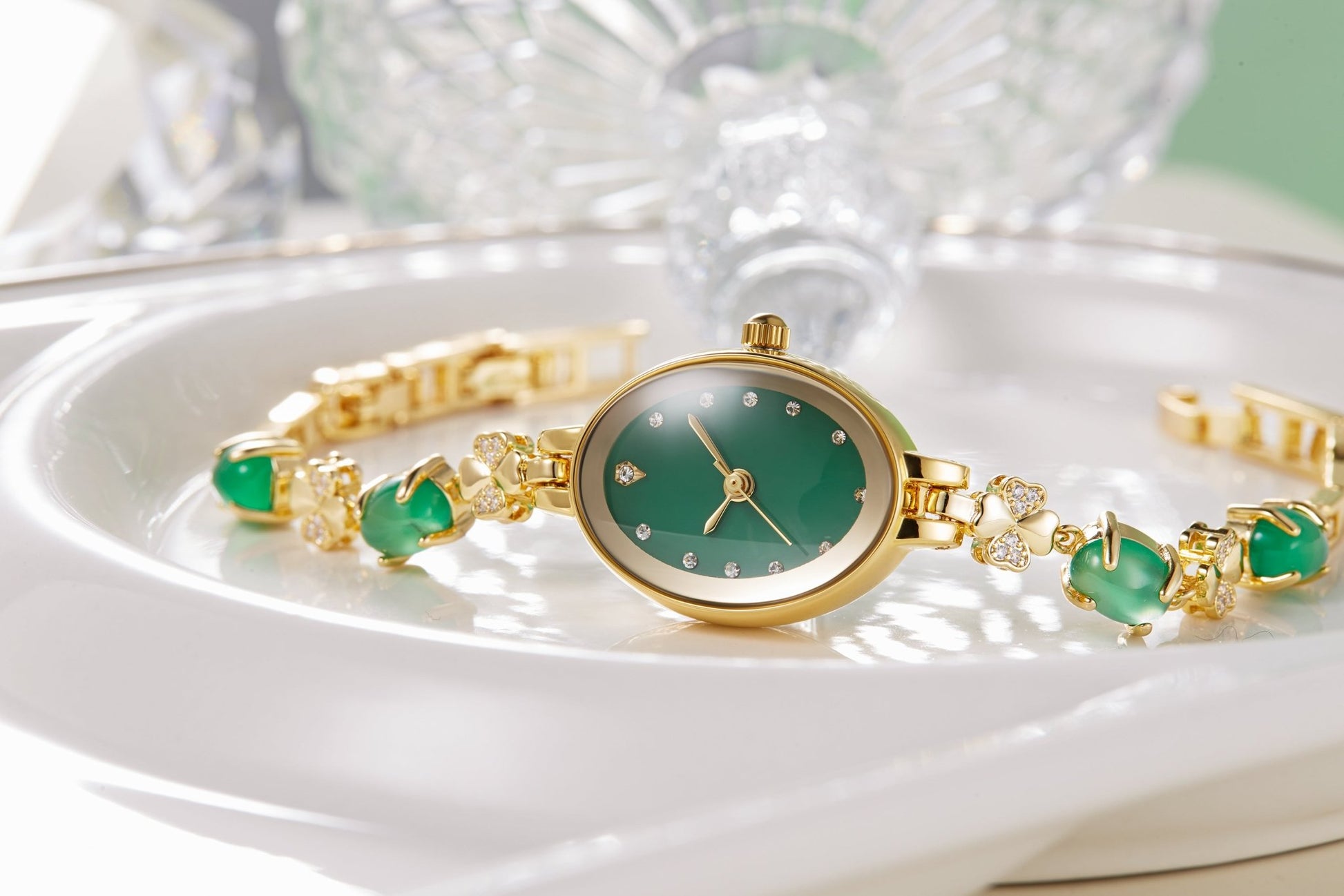Close-up of the "Goose Egg" oval green dial featuring four-leaf clover and chalcedony accents - Time100